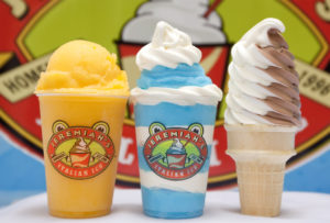 Three Jeremiah’s Italian Ice products: yellow ice, blue and white gelati and swirled soft serve.