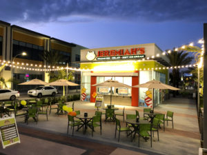 A Jeremiah’s Italian Ice location at night with string lights
