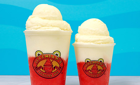 Two Jeremiah's Italian Ice ice cream cups filled with red and white ice cream