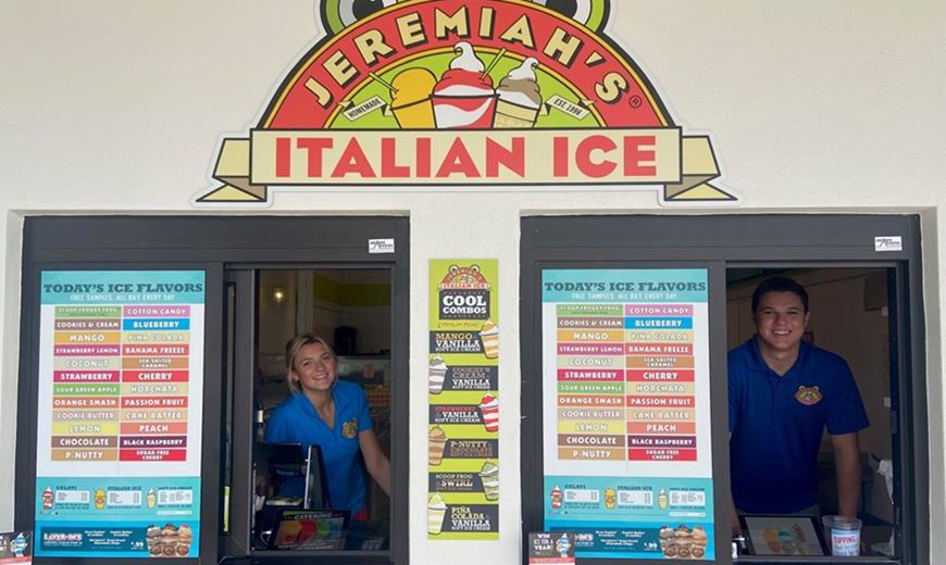 Image of two smiling Jeremiah’s Italian Ice employees in the walk-up windows