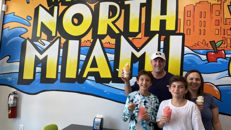 Family standing in front of Jeremiah's North Miami store